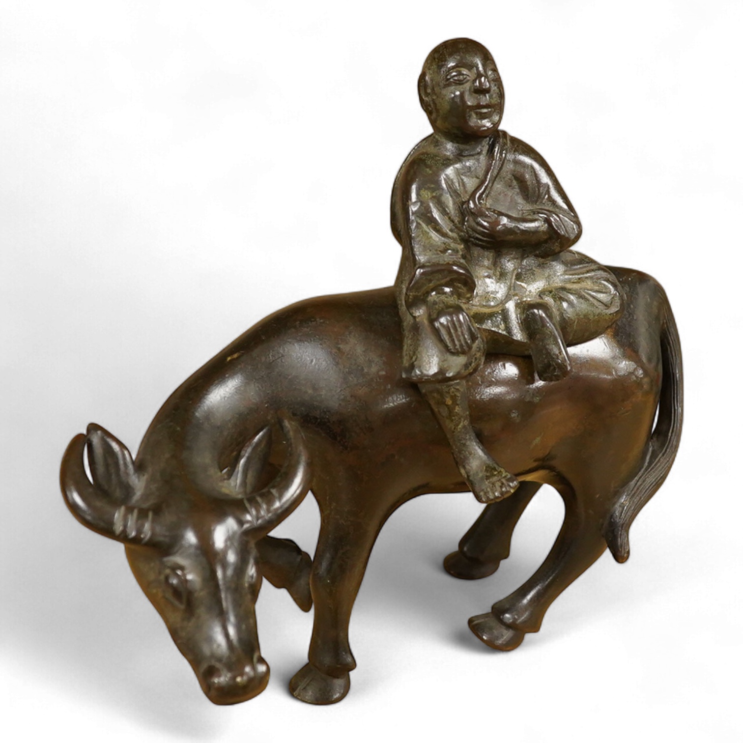A Chinese bronze buffalo and figural incense burner, 18cm high